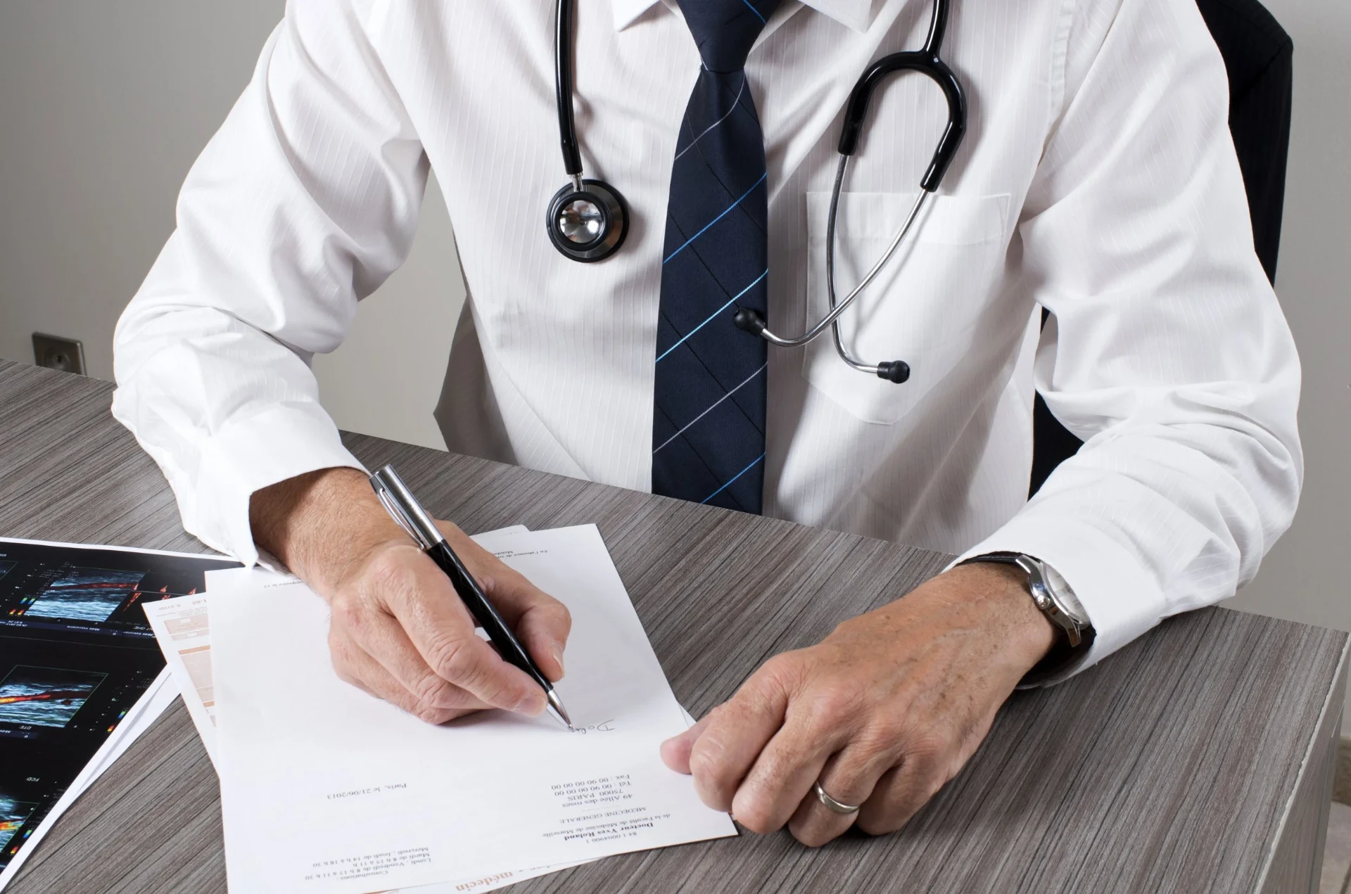 Senior occupational health clinician consulting with a business professional