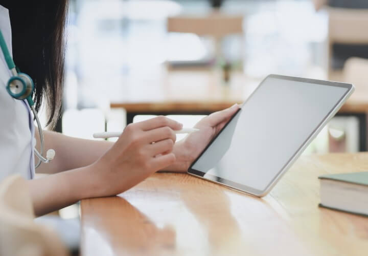 Clinician using a tablet for a remote case management consultation