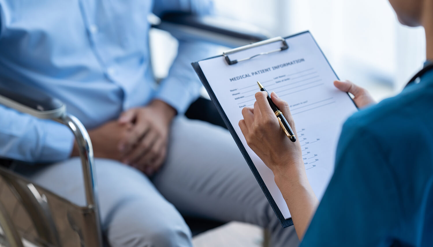 Occupational health clinician reviewing a health questionnaire
